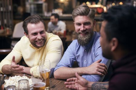Men spending the weekend in the pubの写真素材