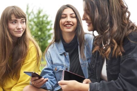 Girls spending time together outdoors の写真素材