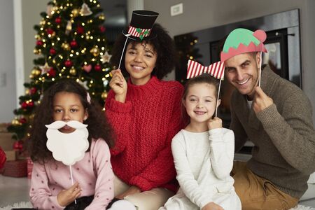 Portrait of happy family in Christmas masks