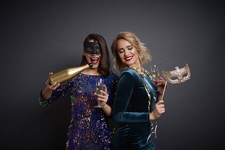 Friends celebrating new year with champagneの写真素材