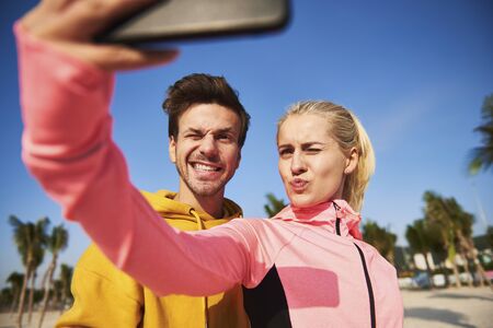 Selfie of young couple after workout on the fresh air