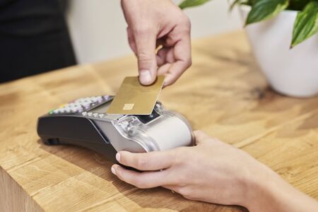 Paying by credit card in hair salonの写真素材