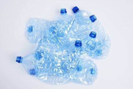 Crushed plastic bottles on white background 