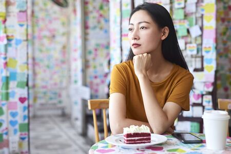 Beautiful Vietnamese woman in a cafeの写真素材