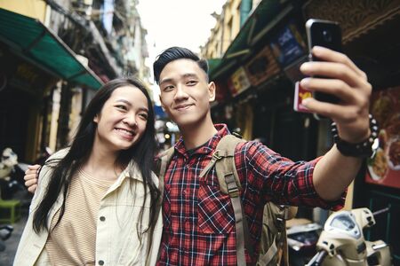 Close up selfie of happy young Vietnamese friendsの写真素材