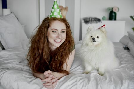 Birthday celebration of woman and her dogの写真素材