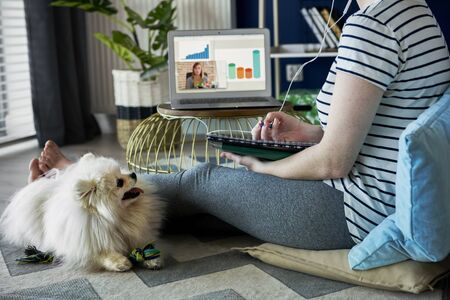Unrecognizable young woman at home office 
