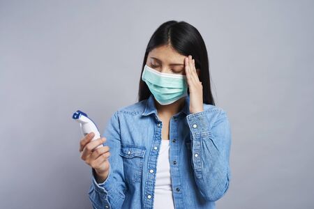 Asian woman feeling to have a temperature の写真素材