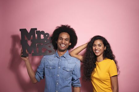 Portrait of African couple with the inscription in studio shot.