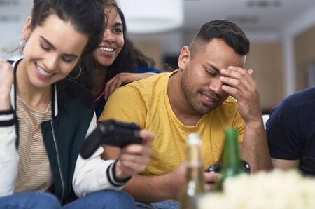 Girl winning while playing on the game console.の写真素材
