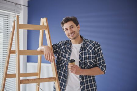 Portrait of handyman having a coffee breakの写真素材