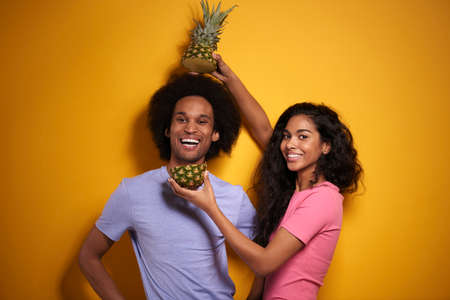 Cheerful couple and tasty pineappleの写真素材