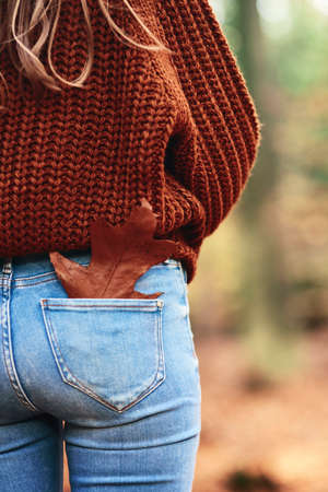 Rear view of the leaf in the trouser pocketの写真素材