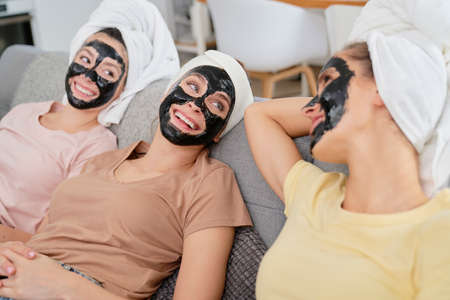 Three friend with face masks on facesの写真素材