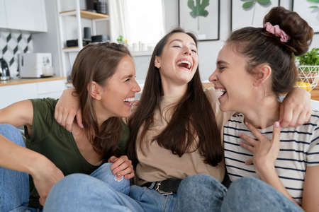 Three best friends having a good time laughingの写真素材