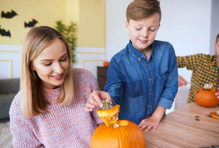 Parent and child making carved pumpkinの写真素材