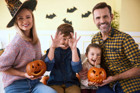 Portrait of family and halloween pumpkinsの写真素材