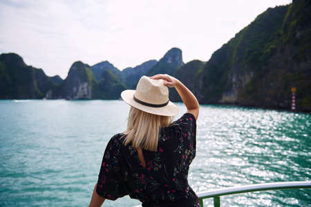 Rear view of young woman among the beautiful nature