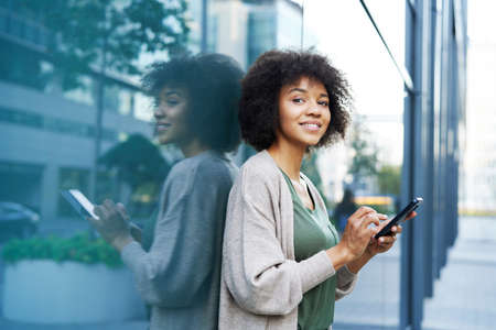 Woman with mobile phone in the city