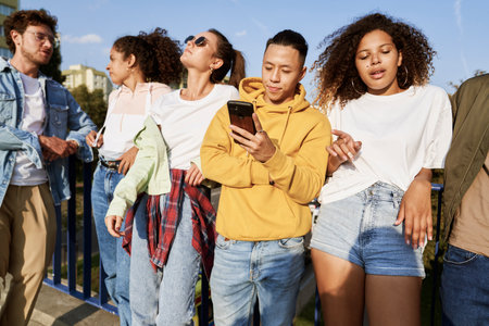 Group of young people standing together on a sunny dayの写真素材