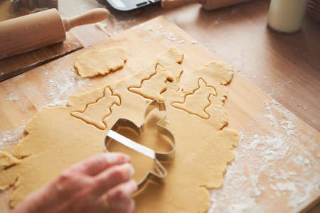 Close up of cutting rabbit shapes out of pastry doughの写真素材