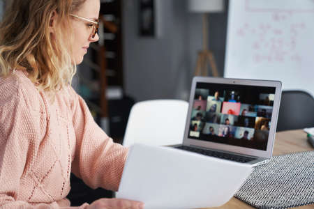 Young female teacher teaching remotely at home