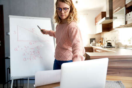 Teacher explains math tasks while homeschooling