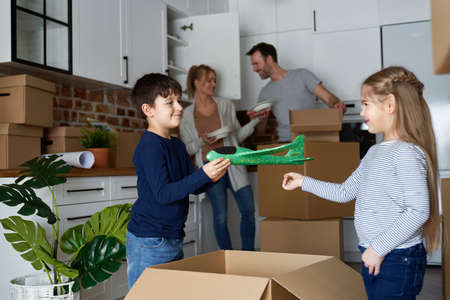Happy family during moving to a new homeの写真素材