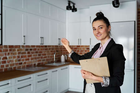 Real estate agent agent invites you to view the apartmentの写真素材