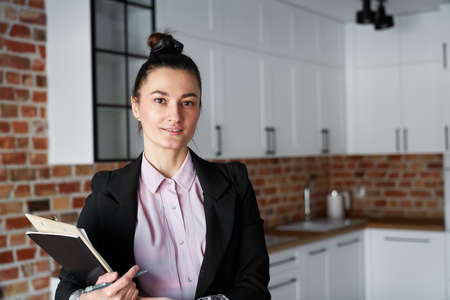 Close up of portrait of real estate agent in new apartmentの写真素材