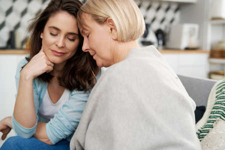 Close up of two sad women at home