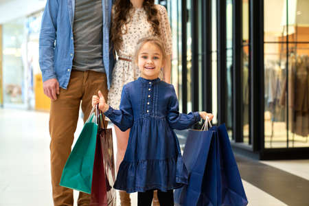 Portrait of little girl during shopping at the mallの写真素材