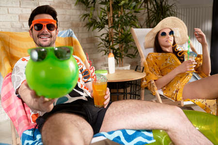 Playful man with woman during vacation at home