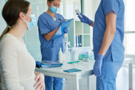 Close up of pregnant woman vaccination procedureの写真素材