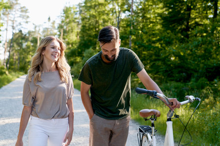 Couple walking on a date in the woodsの写真素材
