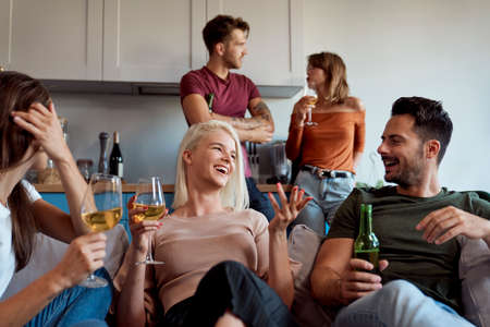 Friends having great fun on home partyの写真素材