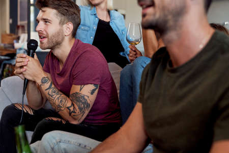 Man singing on karaoke party