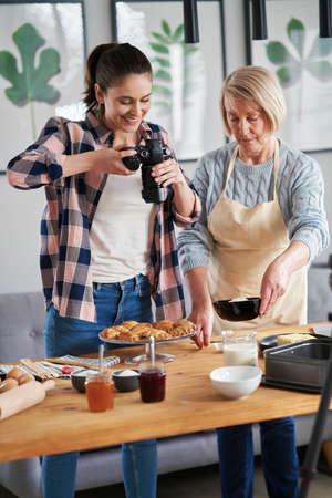 Vertical image of two food bloggersの写真素材