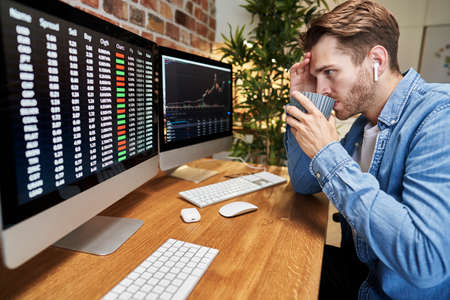 Adult man following stock market dataの写真素材