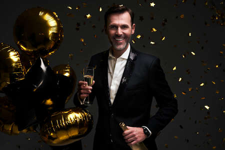 Elegance man with glass of champagneの写真素材