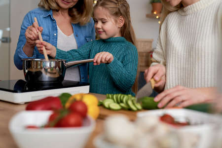 Bottom view of three women cooking in the kitchenの写真素材
