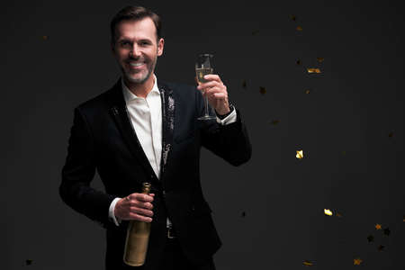 Elegance man with glass of champagneの写真素材