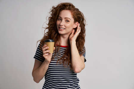 Redhead woman with cup of coffee