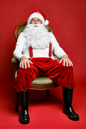 Portrait of caucasian Santa Claus sitting on the retro chairの写真素材