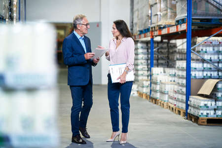 Caucasian mature man and woman discussing in a business meetingの写真素材