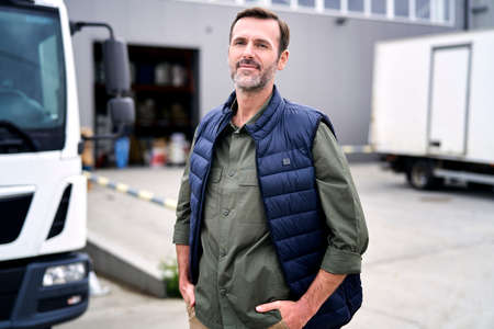 Portrait of caucasian man out of warehouse building