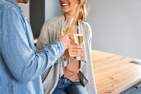 Couple celebrating house ownership with a champagneの写真素材