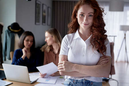 Portrait of ginger caucasian woman in workshopの写真素材