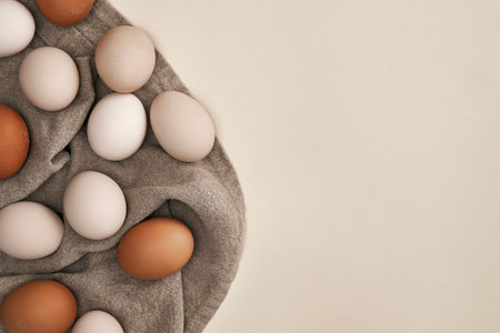 Directly above shot of natural eggs on the natural textileの写真素材