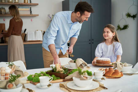 Caucasian family before an easter dinner at homeの写真素材